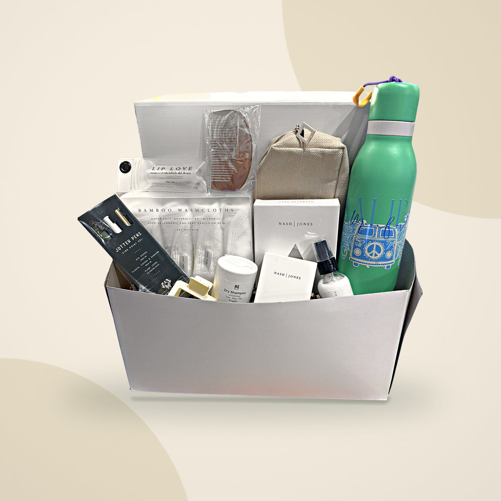 Recovery Ready Essential Kit packed in its gift box: toiletries, washcloths, comb, lip balm, toiletry bag and water bottle