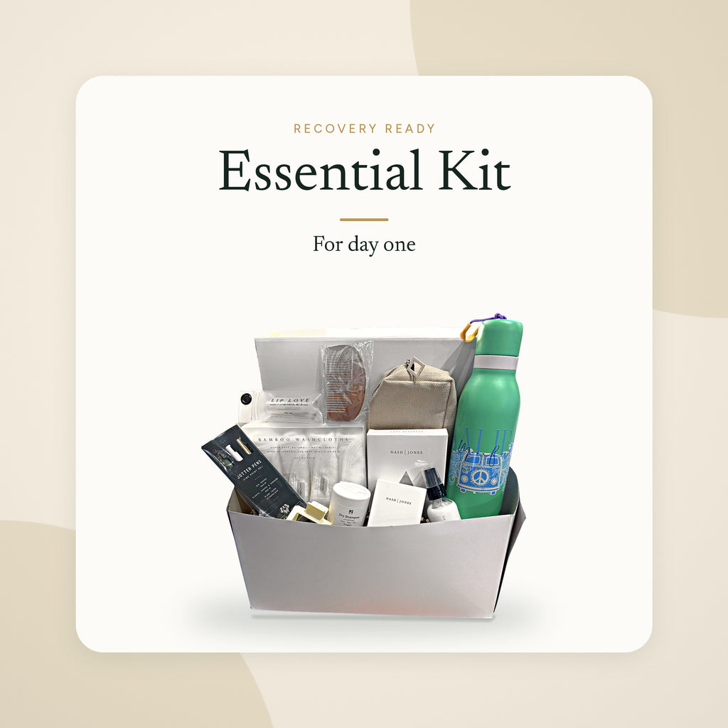 Recovery Ready Essential Kit packed in its gift box: toiletries, washcloths, comb, lip balm, toiletry bag and water bottle