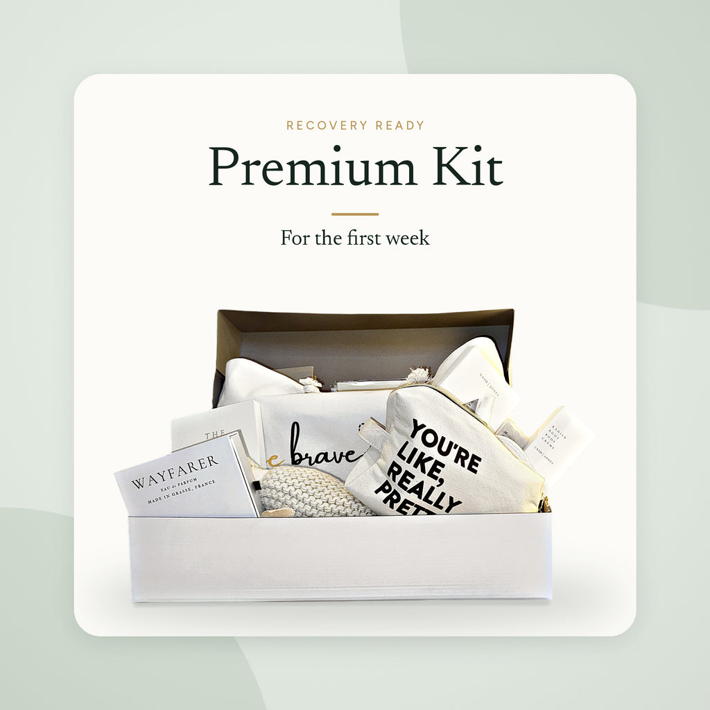 Recovery Ready Premium Kit in its gift box: knit throw, canvas pouches, body crème, journal and comfort items